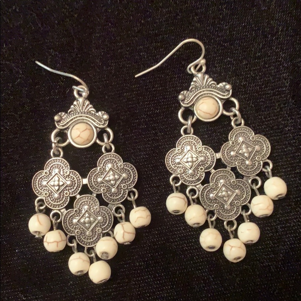 Silver tone and white dangle earrings